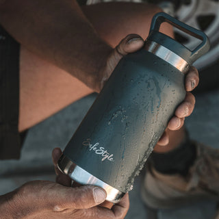 Fusions safety glasses, Big Juicy water bottle, and coffee cup in a lifestyle setup