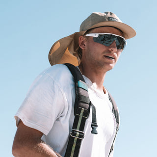 Phantoms Matte White safety glasses on a person, frontal view, polarised lenses visible